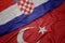 waving colorful flag of turkey and national flag of croatia