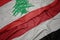waving colorful flag of yemen and national flag of lebanon