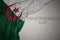 waving colorful national flag of algeria on a gray background with text independence day