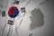 Waving colorful national flag and map of south korea.