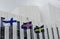 Waving Finnish, Swedish, Icelandic flags against of Finlandia Ha