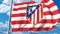 Waving flag with Atletico Madrid football team logo. Editorial 3D rendering