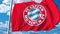 Waving flag with Bayern Munchen football team logo. Editorial 3D rendering
