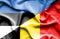 Waving flag of Belgium and Estonia