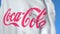 Waving flag with the Coca-Cola Company logo, close-up. Editorial 3D rendering