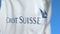 Waving flag with Credit Suisse Group AG logo, close-up. Editorial 3D rendering