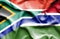 Waving flag of Gambia and South Africa