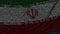 Waving flag of Iran made of text symbols on a computer screen. Conceptual loopable animation