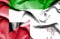 Waving flag of Malta and United Arab Emirates