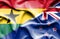 Waving flag of New Zealand and Ghana