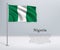 Waving flag of Nigeria on flagpole. Template for independence da
