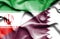 Waving flag of Qatar and Iran