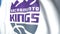 Waving flag with Sacramento Kings team logo, close-up. Editorial 3D rendering