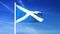 Waving flag of Scotland on the blue sky background