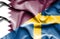 Waving flag of Sweden and ,Qatar
