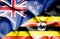 Waving flag of Uganda and New Zealand