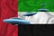Waving flag of United Arab Emirates. UFO group on the background of the flag. UFO news concept in the country. 3D rendering