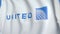 Waving flag with United Continental Holdings logo, close-up. Editorial 3D rendering