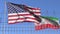 Waving flags of the USA and Iran separated by barbed wire fence. Conflict related loopable conceptual 3D animation