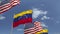 Waving flags of Venezuela and the USA on sky background, loopable 3D animation