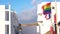 Waving gay pride rainbow flag next to the flags of European states in Gran Canaria Spain, symbol of the LGBT community