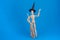 Waving Halloween witch wearing black pointed witch hat holding a broom