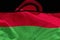 Waving Malawi flag for using as texture or background, the flag is fluttering on the wind