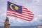 Waving Malaysian flag on beach in Langkawi