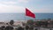 Waving national flag of Turkey on blue sky. Big red flag featuring white star waving on flagpole