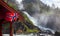 Waving norwegian flag at Latefoss twin waterfall Odda Hordaland Norway Scandinavia