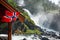 Waving norwegian flag at Latefoss twin waterfall Odda Hordaland Norway Scandinavia