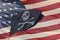 Waving pirate flag jolly roger on usa star and stripes