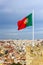 Waving portuguese flag on top of Saint Jorge Castle in Lisbon