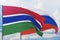 Waving Russian flag and flag of Gambia. Closeup view, 3D illustration.