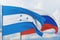 Waving Russian flag and flag of Honduras. Closeup view, 3D illustration.
