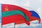 Waving Russian flag and flag of Transnistria. Closeup view, 3D illustration.