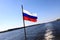 Waving Russian flag on ship