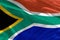 Waving South Africa flag for using as texture or background, the flag is fluttering on the wind