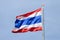 Waving Thai flag with blue sky