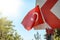 Waving Turkish flag tied to a road sign post. Independence and freedom