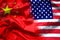 Waving USA and China flag. multinational company investment between US and China, financial concept.