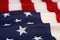 Wavy American flag detail focus on foreground star