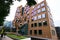 Wavy brick facade of Dr Chau Chak Wing Building with array of rectangular windows at University Technology Sydney UTS, Australia