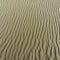 Wavy contours in the sand. The sea has shaped the beach into lines through the waves