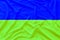 Wavy flag of Ukraine on a terry background