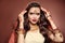 Wavy hair. Portrait of beautiful woman with indian jewelry. Young brunette model with Traditional Indian golden bijouterie set.