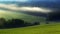 Wavy landscape of Moravian Tuscany with morning fog and sun rays. South Moravia.