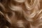 Wavy, long hair against background after hairdressing