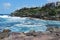 Wavy ocean and rocky coastline near famous Sydney Bondi Beach
