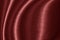 Wavy red fabric texture surface curtain wave with a pattern background. macro texture of red striped fabric